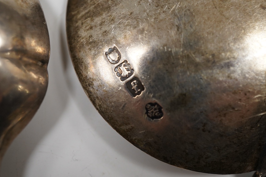 A pair of George III silver gilt Old English pattern berry spoons, London, 1787, 21.8cm, two other earlier silver berry spoons and an Edwardian serving spoon by William Hutton & Sons, London, 1901, 9oz.